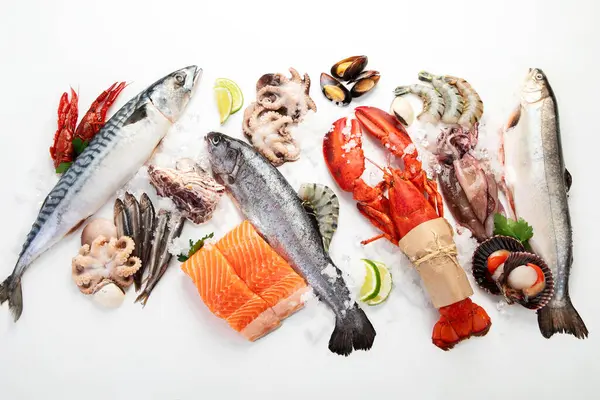 Various seafood and fishes dishes. Healthy food concept on white background, top view.