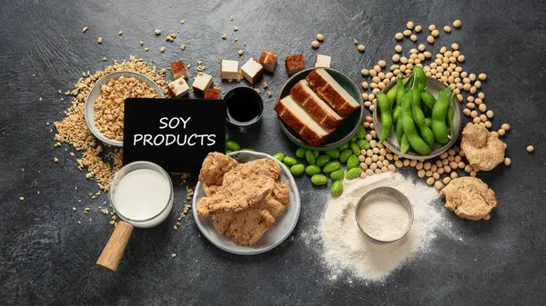 Soy products  on black background. Vegan healthy food. Top view