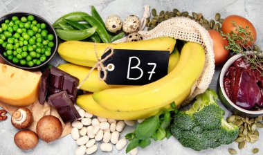 Food high in vitamin B7 on dark background. Healthy diet concept. Top view clipart