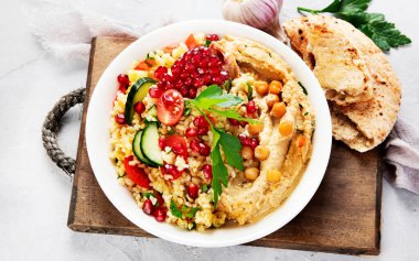 Bulgur and hummus salad . Mediterranean, Arabic  diet concept clipart