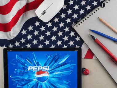 In this photo illustration, Pepsi logo seen displayed on a tablet.
