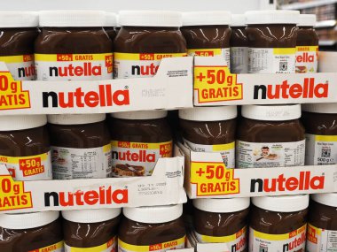 In this photo illustration,  Nutella sweetened palm oil spread, flavored with hazelnut and cocoa solids, generically called chocolate spread at the store.