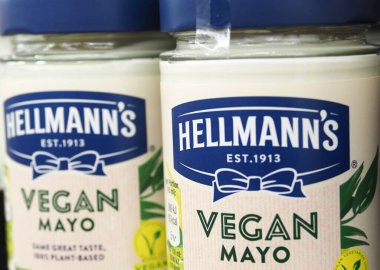 In this photo illustration,  Hellmann's jars of  vegan mayonnaise on a shelf in a store