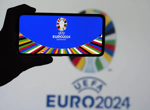 stock image Germany - April 5, 2024: In this photo illustration,  logo of the 2024 UEFA European Football Championship (UEFA Euro 2024) seen displayed on a smartphone