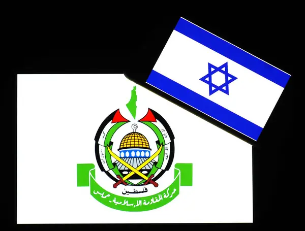 stock image Ukraine - June 19, 2024: In this photo illustration, Israel Flaf  seen displayed on a smartphone and Hamas (Islamic Resistance Movement)  logo on  tablet screen. 