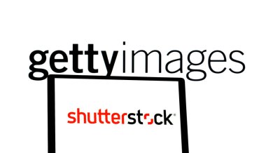 Bavyera, Almanya - 7 Ocak 2025: Bu resimde, Getty Images ve Shutterstock logoları bir tablet ve bir bilgisayar monitöründe gösteriliyor. Getty Images CEO 'su Craig Peters iki şirketin birleşmesini kararlaştırılan bir mektupta duyurdu