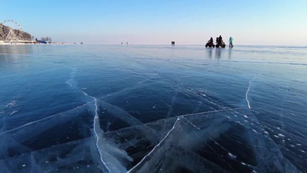 Beautiful Blue Ice Surface Frozen Lake Baikal Listvyanka Village – stockvideo
