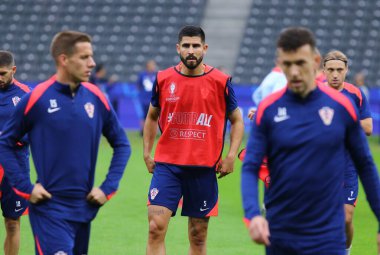 Berlin, Germany - June 14, 2024: Croatian players in action during the Open training session ahead of the UEFA EURO 2024 group stage match Spain v Croatia at Olympiastadion in Berlin, Germany clipart