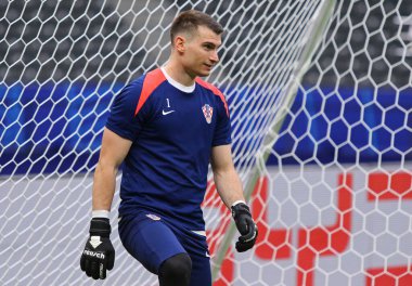Berlin, Germany - June 14, 2024: Goalkeeper Dominik Livakovic (#1) of Croatia in action during Open training session of Croatia national team before UEFA EURO 2024 game against Spain at Olympiastadion clipart