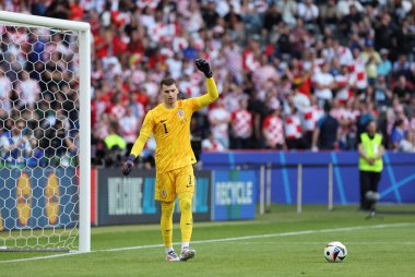 Berlin, Germany - June 15, 2024: Goalkeeper Dominik Livakovic of Croatia reacts after missed third goal during the UEFA EURO 2024 group stage match Spain v Croatia at Olympiastadion in Berlin, Germany. Croatia lost 0-3 clipart