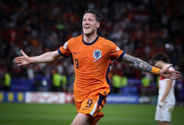 Berlin, Germany - July 6, 2024: Wout Weghorst of Netherlands celebrate after his team won the UEFA EURO 2024 quarter-final game against Turkey at Olympiastadion in Berlin, Germany clipart