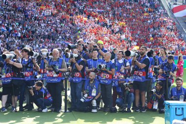 Berlin, Germany - June 15, 2024: Accredited football photographers at work during the UEFA EURO 2024 group stage match Spain v Croatia at Olympiastadion in Berlin clipart