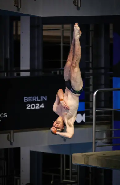 stock image Berlin, Germany - March 22, 2024: Jaxon BOWSHIRE of Australia performs during Mixed 3m & 10m Team Event Final of the World Aquatics Diving World Cup 2024 in Berlin, Germany