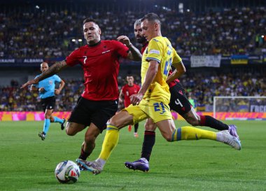 Prague, Czechia - September 7, 2024: UEFA Nations League game Ukraine v Albania at Epet Arena in Prague. Rey Manaj of Albania (L, #7) and Vladyslav Kabaiev of Ukraine (#21) clipart