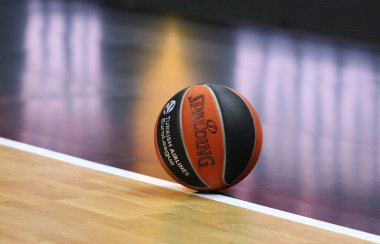 Berlin, Germany - April 4, 2024: Spalding, official Match Ball of the Turkish Airlines EuroLeague seen on the parquet of Uber Arena in Berlin during the basketball game ALBA Berlin v Partizan Belgrade clipart