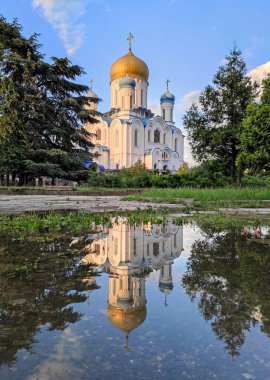 Uzhhorod Orthodox Cathedral (Cathedral of Christ the Saviour) in Uzhhorod city, Ukraine. Also know as Cyril and Methodius Cathedral. Built in 1990. Church reflection in a puddle clipart