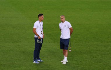 Prague, Czechia - September 7, 2024: Football players Georgiy Sudakov (L) and Mykhailo Mudryk of Ukraine walk on a pitch before the UEFA Nations League game Ukraine v Albania at Epet Arena in Prague clipart