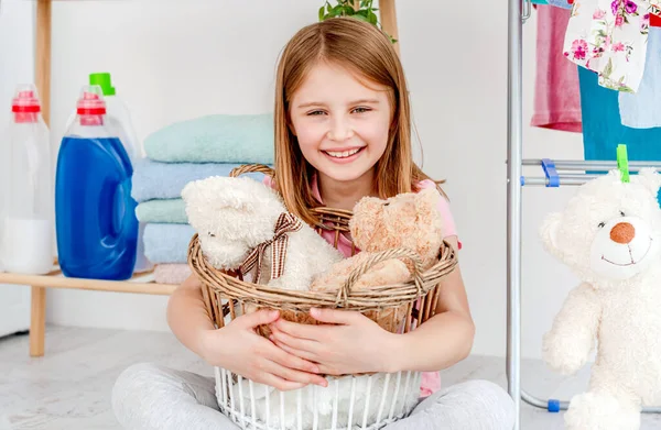 Smiling Little Girl Holding Plush Toys Washing Basket Sitting Floor — Stock Photo, Image