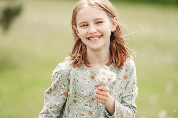 Little Girl Holding Blowballs Flower Hands Blossom Field Smiling Cute — Stockfoto