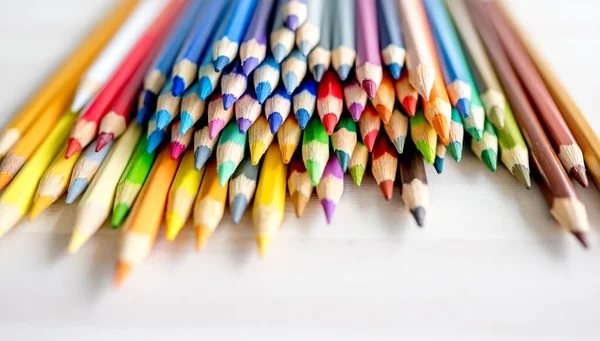 Colorful Pencils Lying Watercolor Paper Closeup Multicolor Crayons Pallete Artist — стоковое фото
