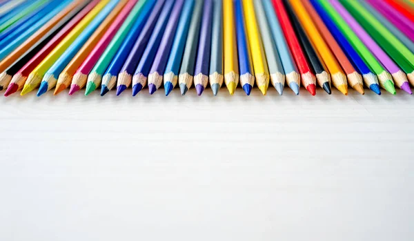 Colorful Pencils Lying Watercolor Paper Closeup Multicolor Crayons Pallete Artist — Stock Photo, Image