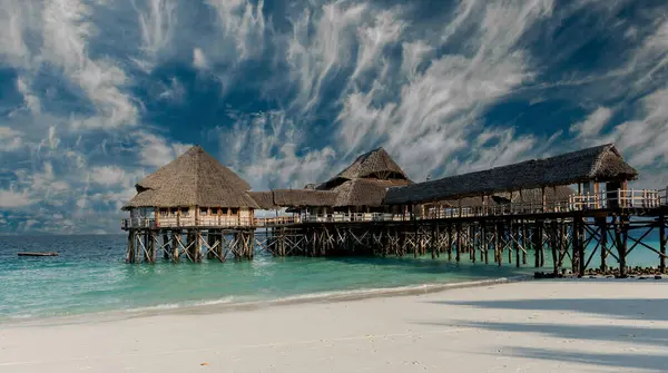 Beautiful View Wooden Pier Thatched Huts Ocean Sandy Beach Zanzibar — Stock Photo, Image