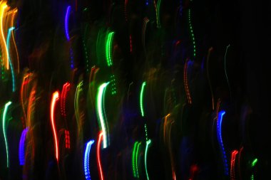 Renkli izlerden ya da ışık yörüngesinden desenli soyut arkaplan