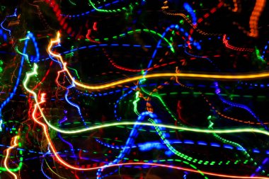 Renkli izlerden ya da ışık yörüngesinden desenli soyut arkaplan