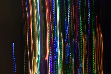 Renkli izlerden ya da ışık yörüngesinden gelen desenli soyut bulanık arkaplan