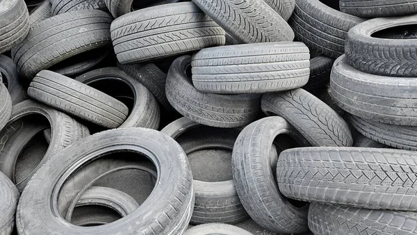 Dump of old used car tires, close up
