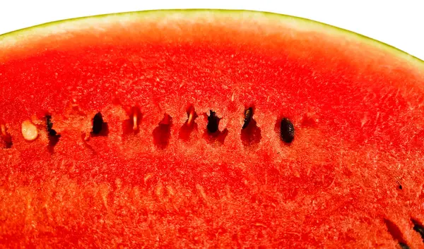 stock image Cut ripe juicy red watermelon with seeds close-up on white background