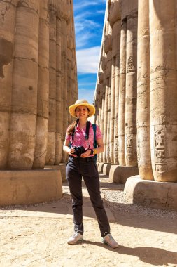 Woman tourist at Luxor Temple in a sunny day, Luxor, Egypt