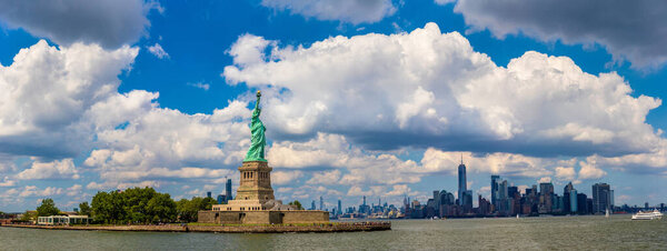 Panorama of Statue of Liberty against Manhattan cityscape background in New York City, NY, USA