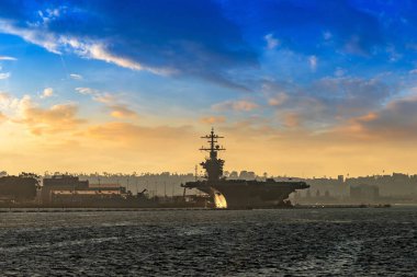 Modern nuclear aircraft carrier in San Diego, California, USA clipart