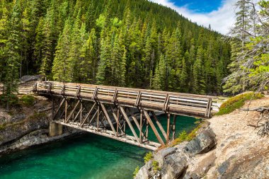 Bridge at Stewart Canyon at Lake Minnewanka in Banff National Park, Canada clipart