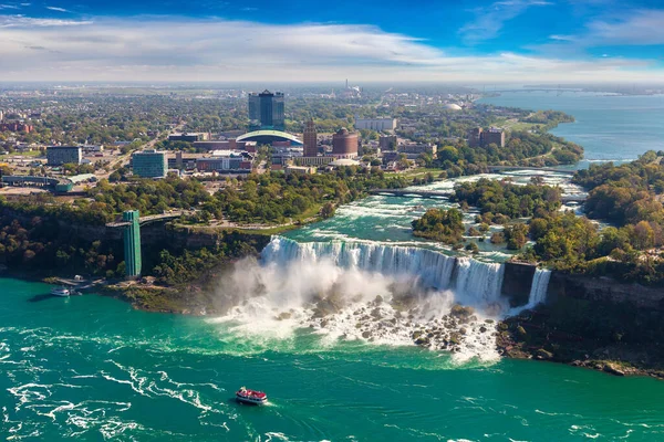 Panoramic aerial view of Canadian side view of Niagara Falls, American Falls and Observation Tower in a sunny day  in Niagara Falls, Ontario, Canada