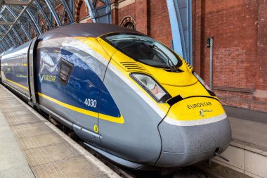LONDON, UK - JUNE 17, 2022: Modern The Eurostar high speed bullet train - connects Paris Gare du Nord and London St. Pancras train station in London, UK clipart