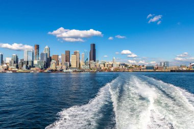 Cruise wash foam in  Elliott Bay and Panoramic view of Seattle cityscape in a sunny day, Washington, USA