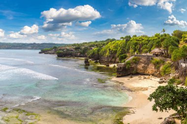 Rocky beach at Nusa Ceningan island in a sunny day, Bali, Indonesia clipart