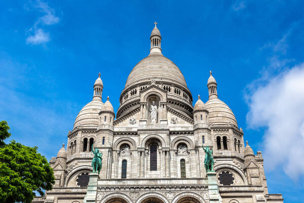 Basilica of the Sacred Heart at Montmartre hill in Paris (Basilica of Sacre Coeur) in a summer day, France