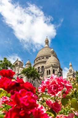 Basilica of the Sacred Heart at Montmartre hill in Paris (Basilica of Sacre Coeur) in a summer day, France clipart