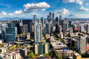 Panoramic aerial view of Seattle business district with Mount Rainier in the background in a sunny day in Seattle, USA clipart