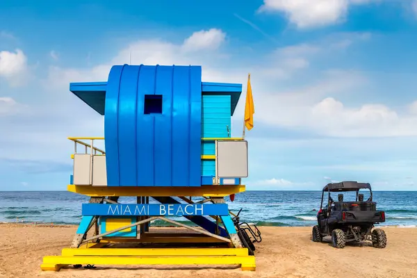 Lifeguard tower and a beach rescue car in South beach, Miami Beach in a sunny day, Florida
