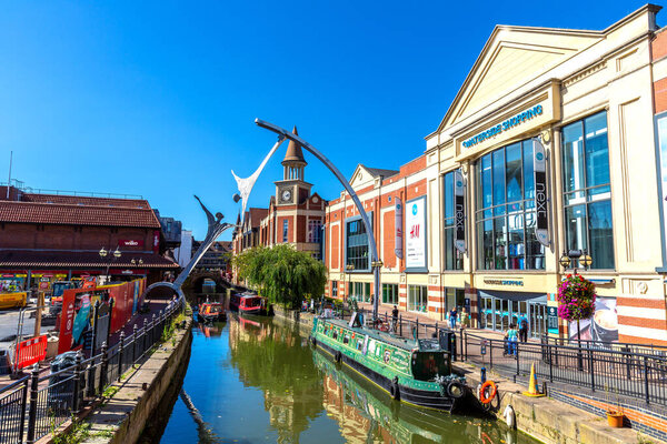 LINCOLN, UK - SEPTEMBER 25, 2023: Waterside shopping centre at the river Witham and sculpture Empowerment by Stephen Broadbent in Lincoln, United Kingdom