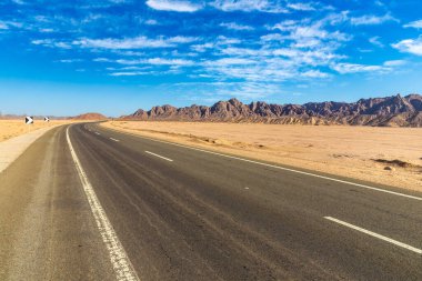 Road in Sahara desert in Egypt in a sunny day