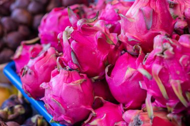 Close up of a Dragon fruit sold on a market in Indonesia. Nutrition and natural poducts growing concept