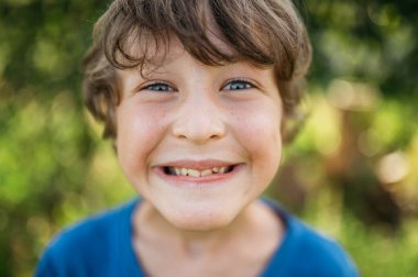 Grimacing Face Boy Portrait, Teenager Closeup clipart