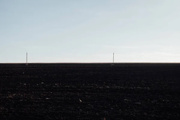 the land is a plowed black field, chernozem of Ukraine, landscape