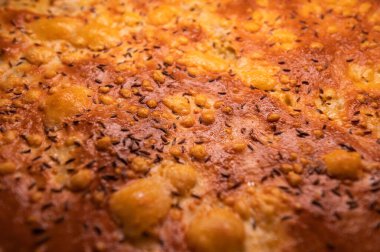 cheese crust on fried pastry with spices. background