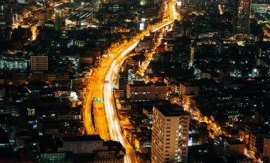traffic in Bangkok, night cityscape with height, district town